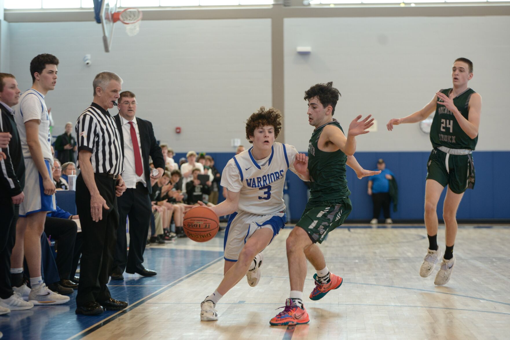 brody calvert drives the basketball